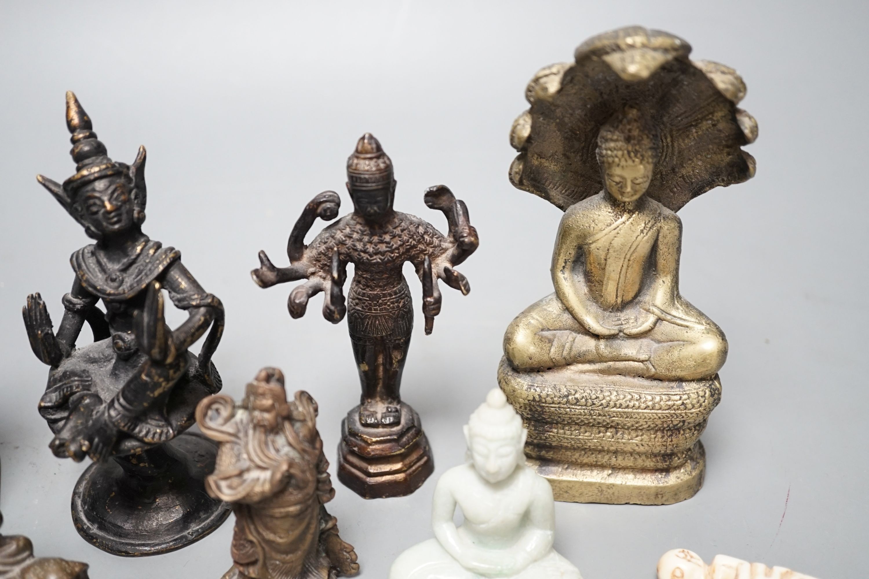 A quantity of Indian and South East Asian bronze and brass models of deities etc.